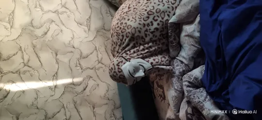 Energetic Figure Jumps on Bed in Artistic Setting – AI Generated Video | Hailuo AI