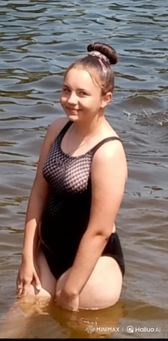Tranquil Beauty: Woman in Mesh Swimsuit by Water – AI Generated Video | Hailuo AI