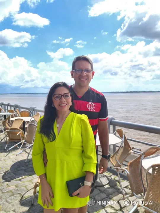 Romantic Couple Embraces on Waterfront Terrace – AI Generated Video | Hailuo AI