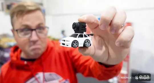 Close-up of a Person Mimicking Eating a Micro RC Car – AI Generated Video | Hailuo AI
