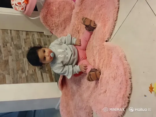 Child Dancing Joyfully on Pink Rug in Cozy Room – AI Generated Video | Hailuo AI