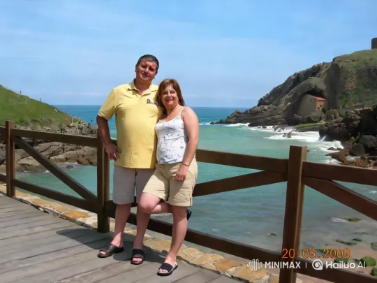 Couple's Tranquil Stroll on Coastal Deck with Scenic Views – AI Generated Video | Hailuo AI