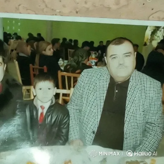 Warmly Lit Gathering with Man, Boy, and Green Wall – AI Generated Video | Hailuo AI
