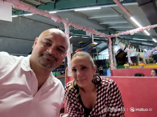 Two Individuals Engage with Camera in Playful Indoor Playground Setting – AI Generated Video | Hailuo AI