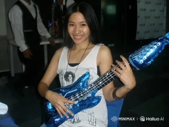 Girl with Blue Inflatable Guitar in Lively Room – AI Generated Video | Hailuo AI