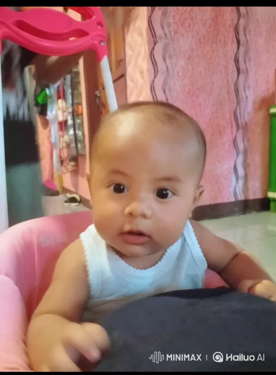 Baby Eating Bread in Pink Chair - Aesthetic Moment – AI Generated Video | Hailuo AI
