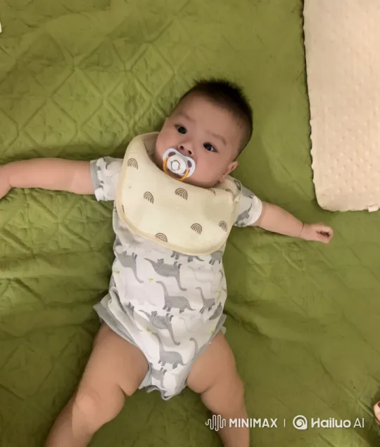 Baby's Playful Planting Adventure on Quilted Surface – AI Generated Video | Hailuo AI