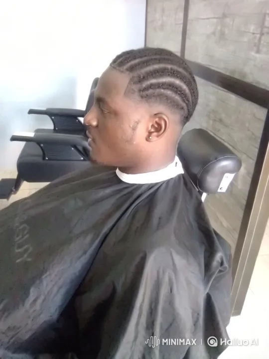 Stylish Cornrow Braiding in Modern Barber Shop – AI Generated Video | Hailuo AI