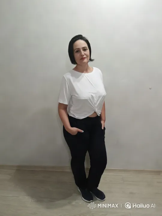 Minimalistic Aesthetic: Woman in Casual Pose – AI Generated Video | Hailuo AI