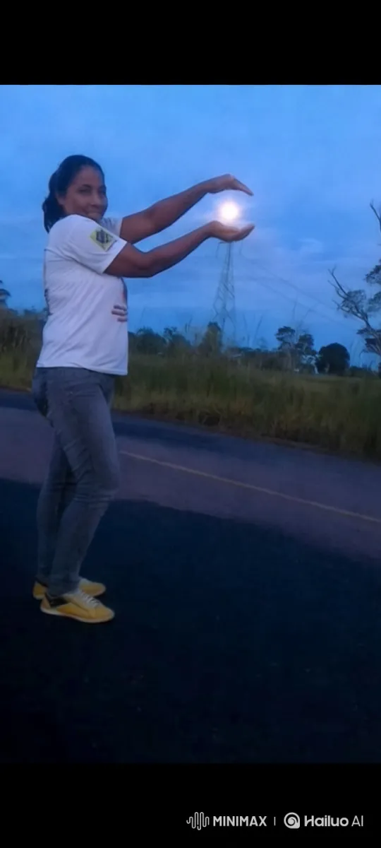 Young Woman Manipulates Light Orb on Serene Road – AI Generated Video | Hailuo AI