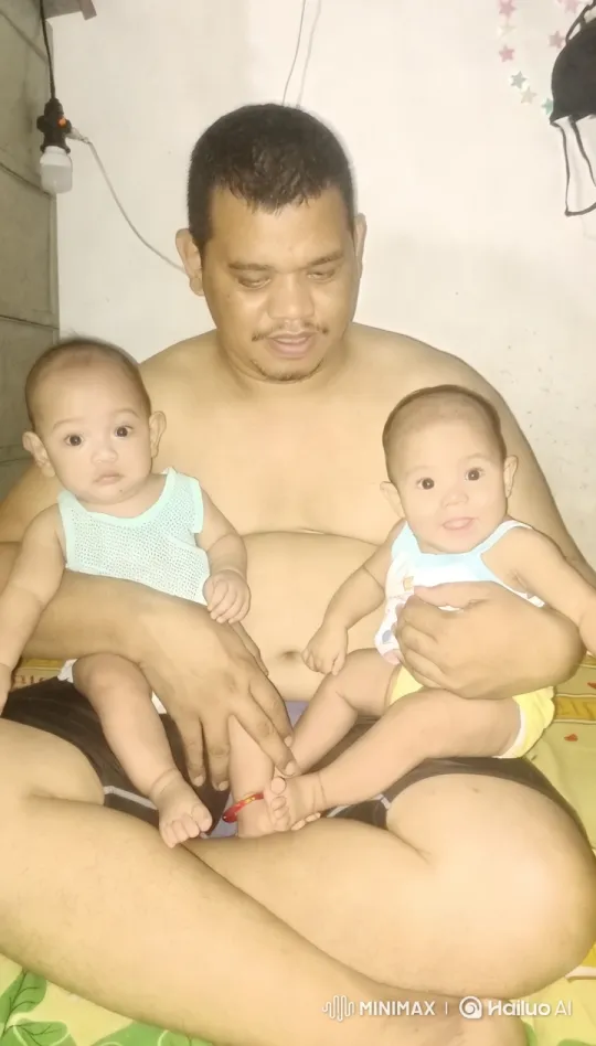 Man and Babies Share Serene Singing Moment – AI Generated Video | Hailuo AI