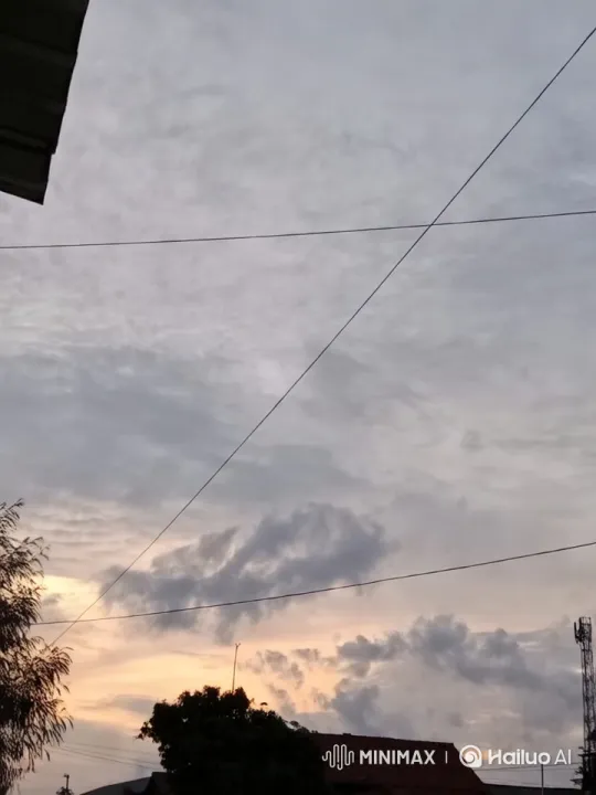 Dusk Sky: Serene Clouds and Tower Silhouette – AI Generated Video | Hailuo AI