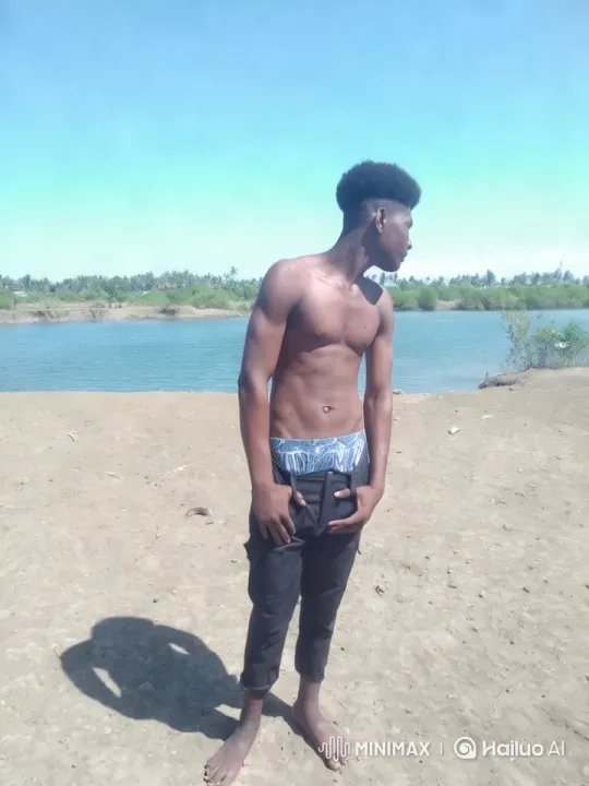 Man on Riverbank: Serene Shot and Dynamic Cinematography – AI Generated Video | Hailuo AI