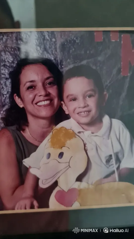 Mother and Son Share Tender Moment with Toy Duck – AI Generated Video | Hailuo AI