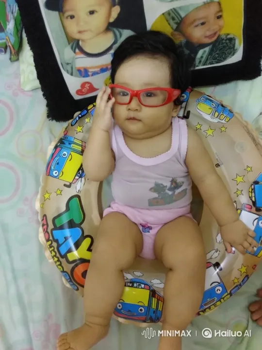 Baby Dancing Joyfully in Colorful Inflatable Ring – AI Generated Video | Hailuo AI