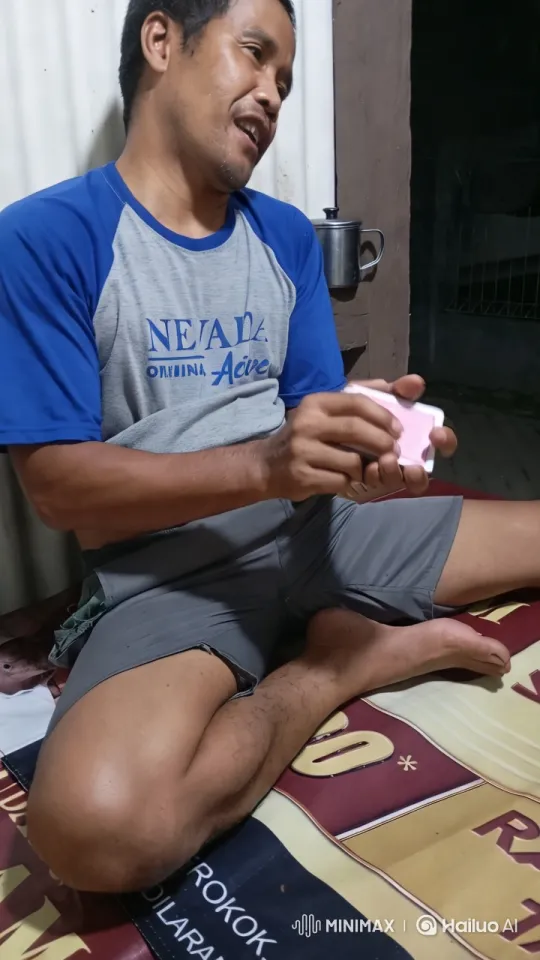Man Dances with Pink Object in Rustic Setting – AI Generated Video | Hailuo AI