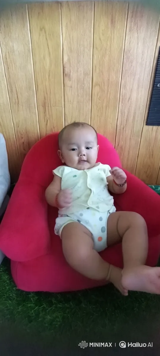 Baby Dancing in Red Chair with Rustic Aesthetic – AI Generated Video | Hailuo AI