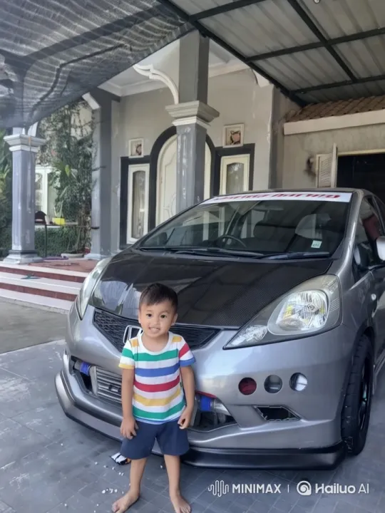 Child Dances by Sporty Silver Car in Elegant Garden Setting – AI Generated Video | Hailuo AI
