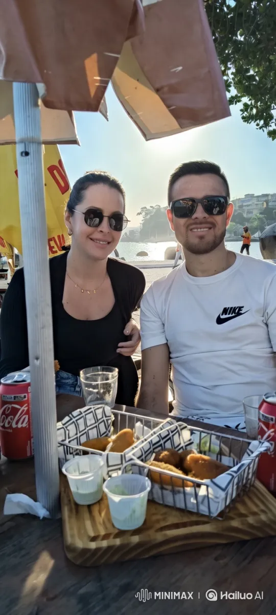 Couple Shares Intimate Kiss at Beachside Café – AI Generated Video | Hailuo AI