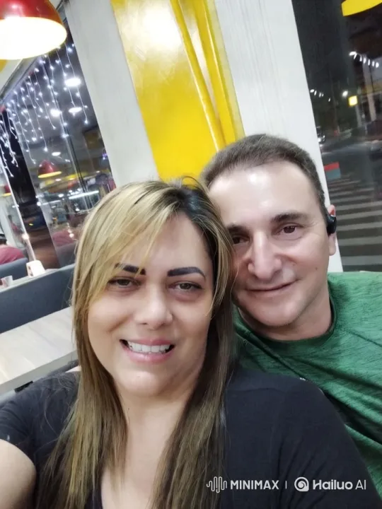 Couple in Modern Diner with Festive Ambiance – AI Generated Video | Hailuo AI