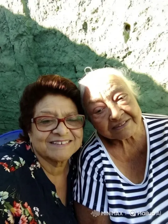 Elderly Women Share Intimate Affection in Sunlit Moment – AI Generated Video | Hailuo AI