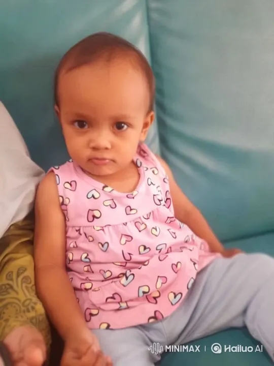 Child Dancing Joyfully on Teal Couch – AI Generated Video | Hailuo AI