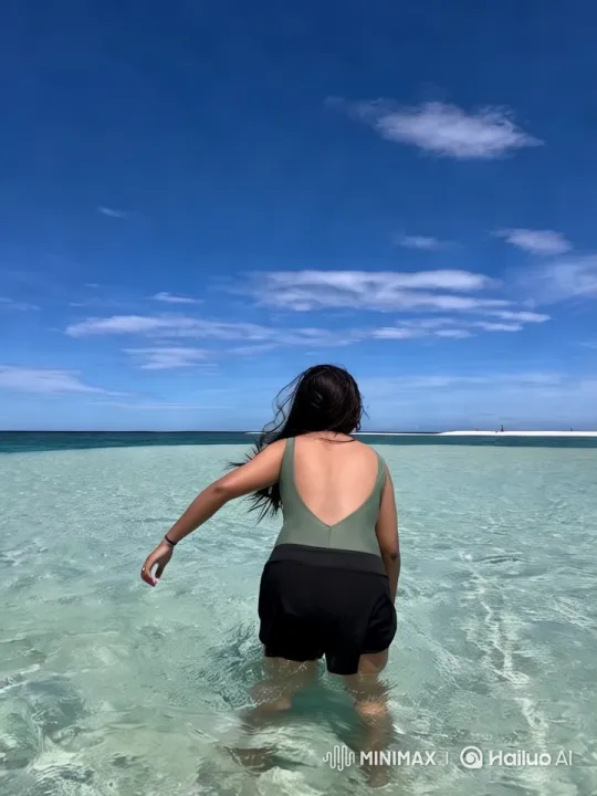 Woman Wades into Serene Beach Waters – AI Generated Video | Hailuo AI