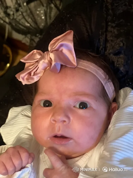 Baby with Bow in Cozy Environment – AI Generated Video | Hailuo AI
