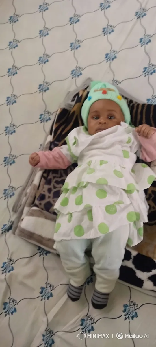 Baby's Playful Awakening on Patterned Bed – AI Generated Video | Hailuo AI