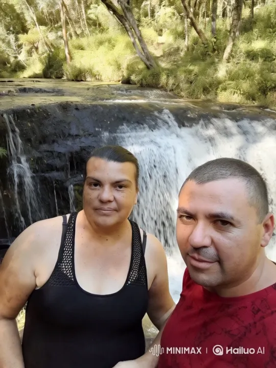 Intimate Kiss in Scenic Waterfall Setting – AI Generated Video | Hailuo AI