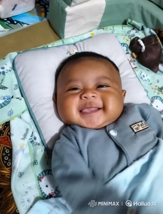 Baby Dances Playfully on Patterned Blanket – AI Generated Video | Hailuo AI