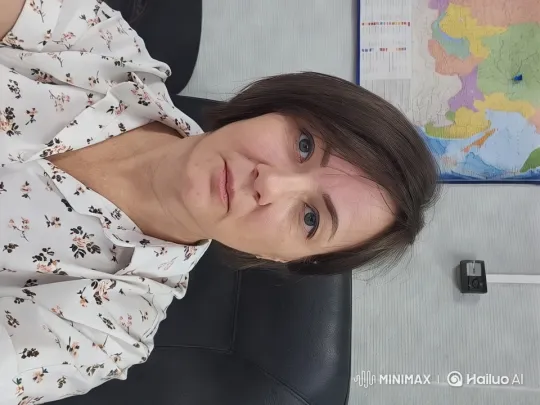 Girl in Floral Shirt Waves in Office Setting – AI Generated Video | Hailuo AI