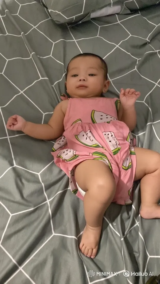Baby Joyfully Dancing on Geometric Bedspread – AI Generated Video | Hailuo AI