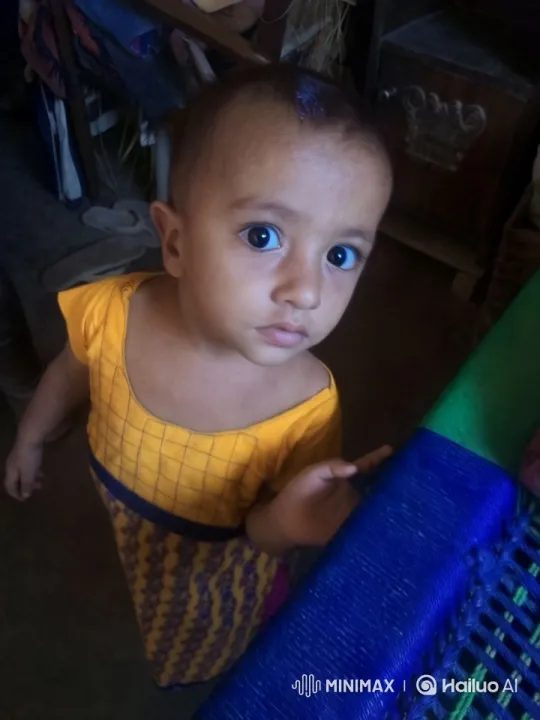 Child in Vibrant Outfit Amidst Cozy Space – AI Generated Video | Hailuo AI