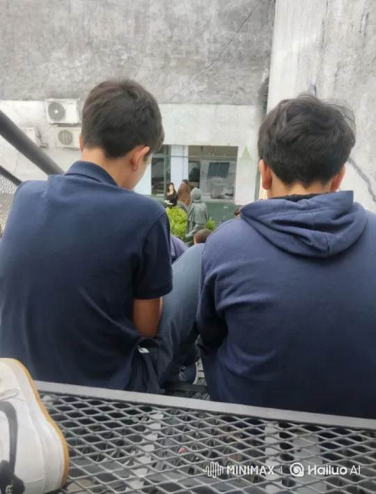 Young Men Share Intimate Moment on Concrete Steps – AI Generated Video | Hailuo AI