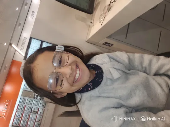 Young Girl in Modern Eyewear Store Setting – AI Generated Video | Hailuo AI