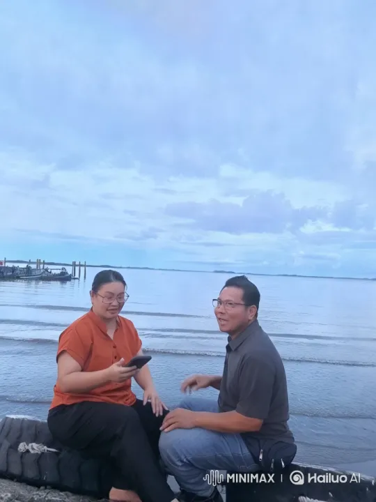 Tranquil Beach Scene with Two Individuals – AI Generated Video | Hailuo AI