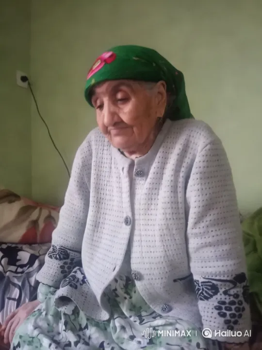 Elderly Woman's Tender Moment with Soft Laughter – AI Generated Video | Hailuo AI