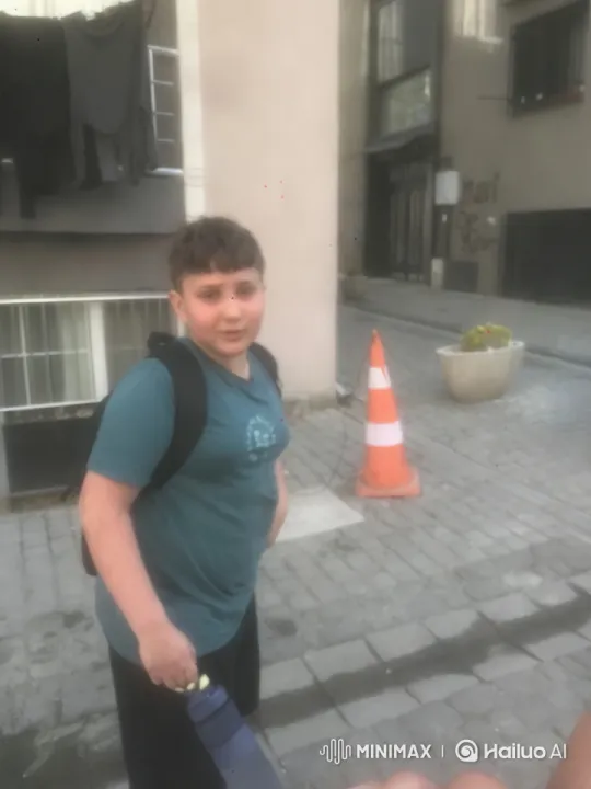 Boy Dancing Playfully on Urban Street – AI Generated Video | Hailuo AI