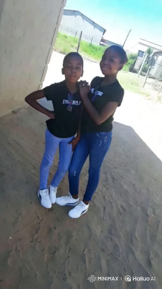 Young Pair Poses Dynamically in Outdoor Setting – AI Generated Video | Hailuo AI
