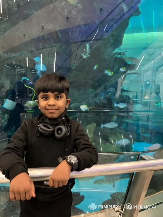 Boy Admires Vibrant Aquarium World – AI Generated Video | Hailuo AI