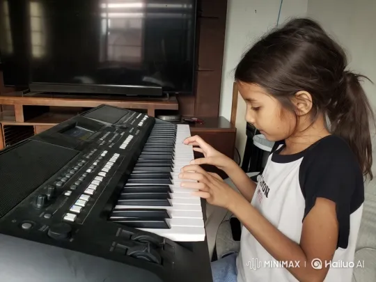 Young Girl Playing Keyboard in Animated Live2D Video – AI Generated Video | Hailuo AI