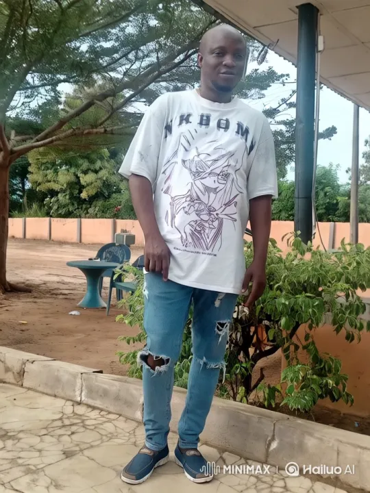 Young Man Showcases Style in Peaceful Outdoor Setting – AI Generated Video | Hailuo AI