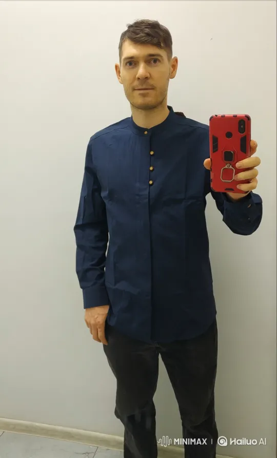 Man Intensely Bites and Chews Red Phone – AI Generated Video | Hailuo AI