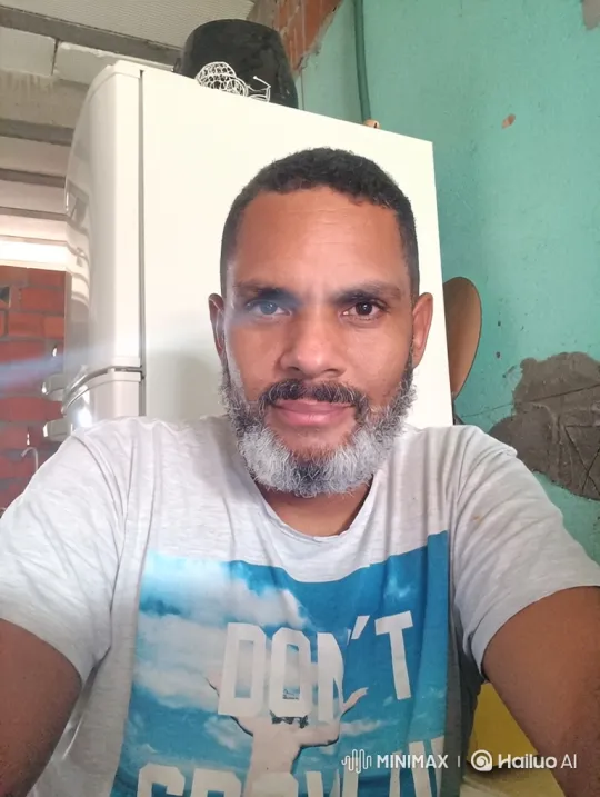 Middle-aged Man in Graphic T-Shirt with Steady Gaze – AI Generated Video | Hailuo AI