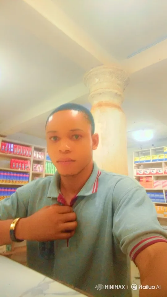 Young Man in Shop, Gazing at Camera – AI Generated Video | Hailuo AI