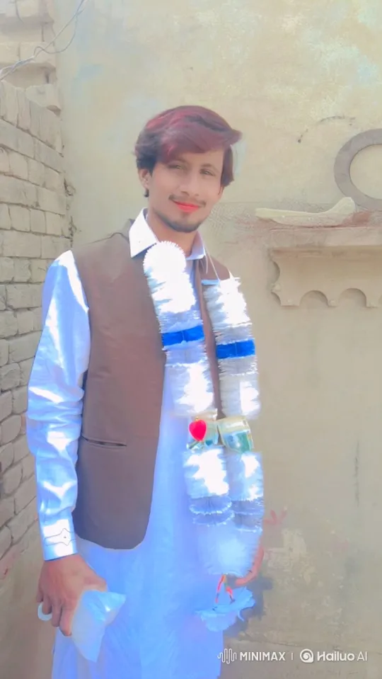 Young Man in White Shirt and Garland - Gentle Smile – AI Generated Video | Hailuo AI