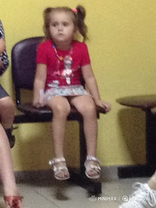 Young Girl in Thoughtful Pose on Yellow Wall – AI Generated Video | Hailuo AI
