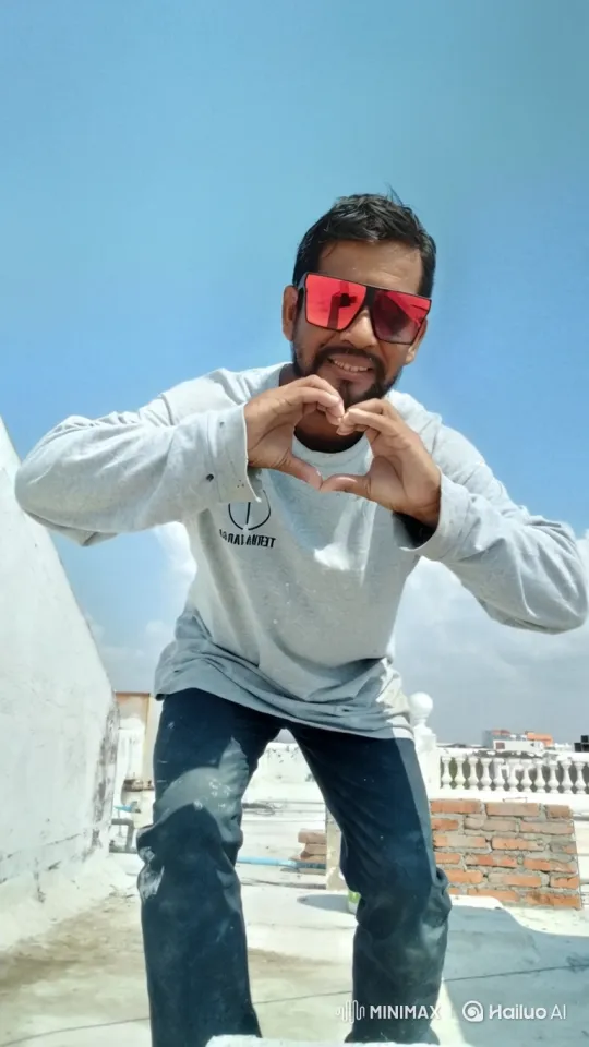 Man on Rooftop Makes Heart Sign with Warm Smile – AI Generated Video | Hailuo AI