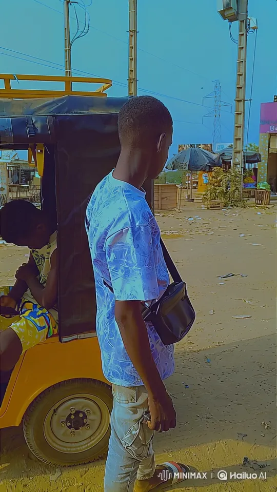 Young Man Walks Through Dusty Market, Video Tracking Shot – AI Generated Video | Hailuo AI
